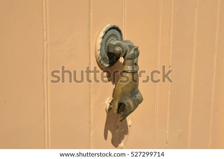 knocker Hand on the door