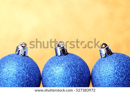 Christmas and New Year toys decorations on vibrant glitter background