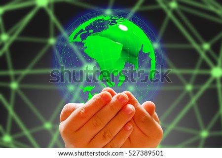 kid's hand holding globe in dark background