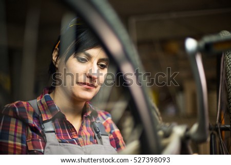 Female bike repair craftsman