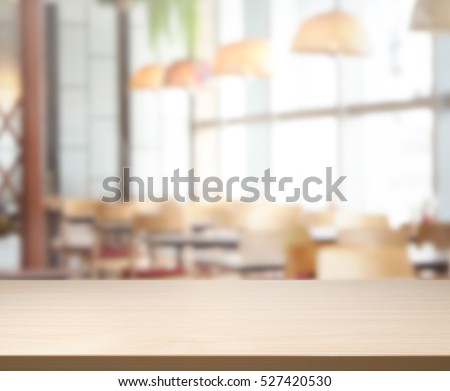 Table Top And Blur Restaurant Of The Background Royalty-Free Stock Photo #527420530