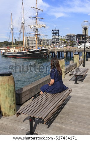 Women take a rest at harbour.