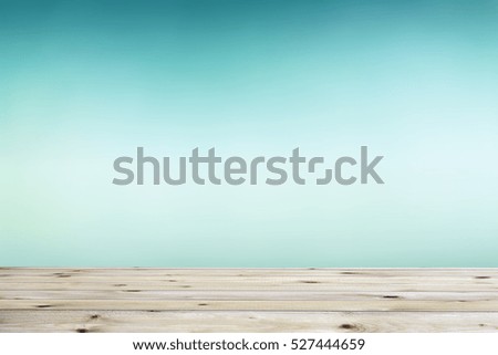 Wood table top on blur nature background, used for montage or display your products