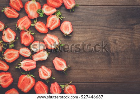 fresh strawberries on the brown wooden table