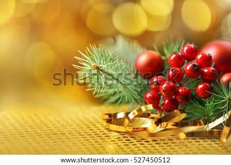 Composition of mistletoe, ribbon and coniferous branch on blurred background, close up