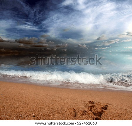 a beautiful sandy beach and the waves of the Mediterranean Sea under sunny skies