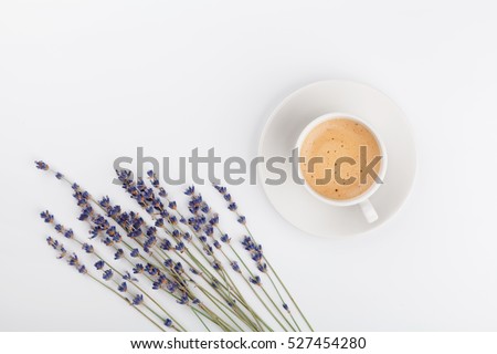 Coffee and lavender flower on white table from above. Woman working desk. Cozy breakfast. Mockup. Flat lay style