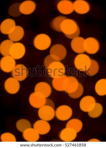 Orange abstract circular lights blurred bokeh holiday background of Christmas light