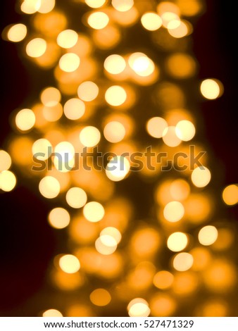 Abstract diffused festive holiday background of Christmas lights on dark background