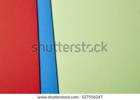 Colored cardboards background in red blue green. Copy space. Horizontal