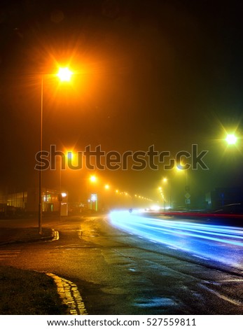 Urban city road long exposure.Night photo .Bllured lines of car