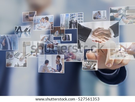 Businessman touching a photo on a digital screen interface, abstract images of business situations