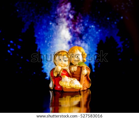 Christmas nativity scene statue with stars background