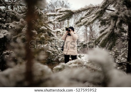 photographer to take pictures in the winter forest.
