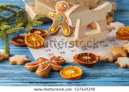 Christmas decoration with fir and pinecone on wooden board