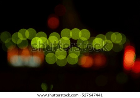 blurred picture for background lighting Amusement park ride at night. conceptual image of entertainment & fun