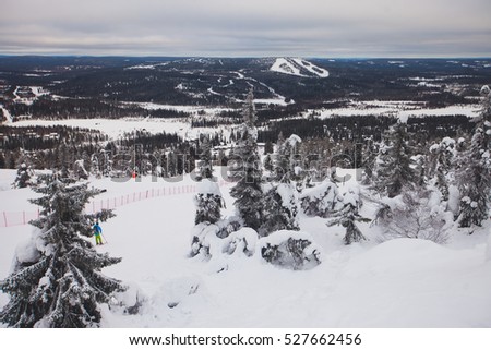 Beautiful cold mountain view of ski resort, winter day with slope, piste and ski lift, evening twilight night picture