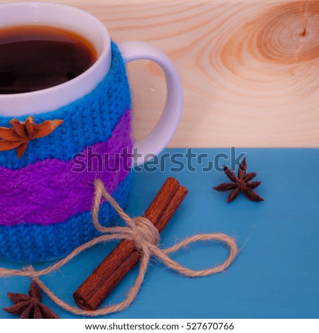 Cristmas theme - big  bright tea cup and cinnamon roll, wooden snowflakes