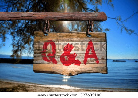 Questions and answers motivational phrase sign on old wood with blurred background