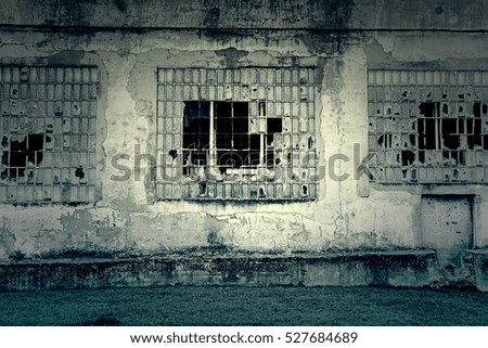 Windows of a building in ruins, detail of an abandoned building, crime and vandalism