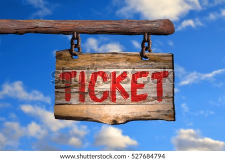 Ticket motivational phrase sign on old wood with blurred background
