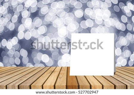 white card put on table and blurred bokeh out of focus in christmas night light background. product display template. Business presentation.clipping path include