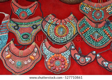 Tibetan jewelry. Necklaces of precious stones. The Anjuna market in Goa