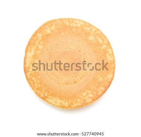One plain pancakes on a white background. Royalty-Free Stock Photo #527740945