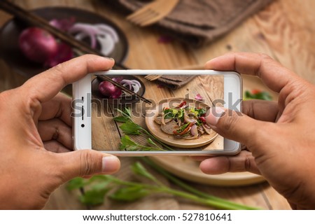 Two hand take the food photo with smartphone