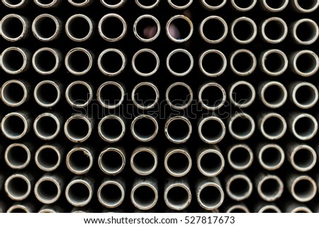 steel tubes of the heat exchanger, the water heater in the boiler as background at fabrication industrial