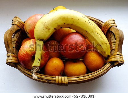 A basket of apples and a banana Royalty-Free Stock Photo #527818081