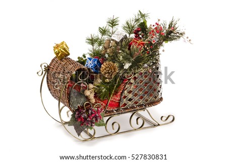 Christmas sled ornament full of festive items isolated on white
