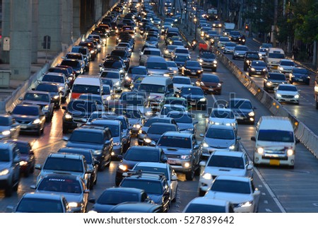 Aerial blurred image of traffic along in Bangkok,Thailand. High-occupancy vehicle lane used at peak travel times. Urban infrastructure problem.

 Royalty-Free Stock Photo #527839642