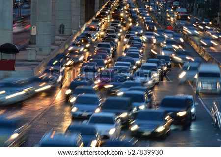Aerial blurred image of traffic along in Bangkok,Thailand. High-occupancy vehicle lane used at peak travel times. Urban infrastructure problem.

 Royalty-Free Stock Photo #527839930