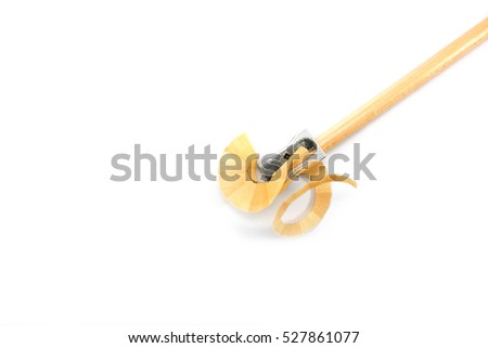 Wooden pencil and pencil sharpener on white background. Pencil inside the sharpener.
