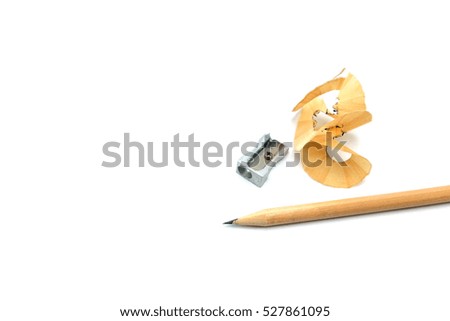 Wooden pencil and pencil sharpener on white background.