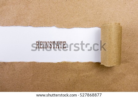 Torn brown paper on white surface with "REINSTATE" word. Business concept
