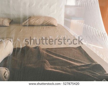 soft retro bedroom with net and sunlight