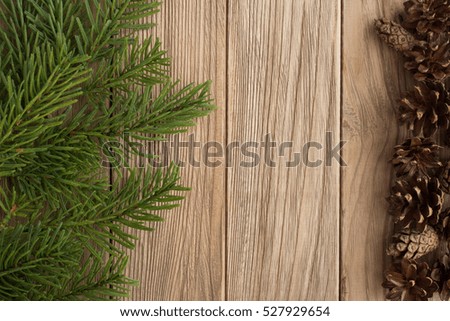 Christmas tree and cones on the wooden table
