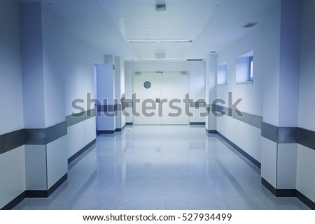 Empty hospital hall with white walls, medicine Royalty-Free Stock Photo #527934499