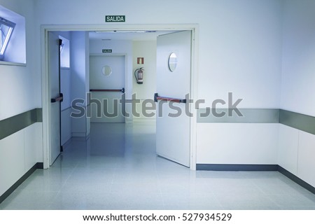 Empty hospital hall with white walls, medicine Royalty-Free Stock Photo #527934529