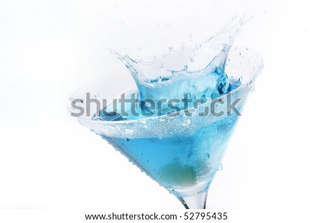 Olive splashing on blue martini isolated on white stock photo