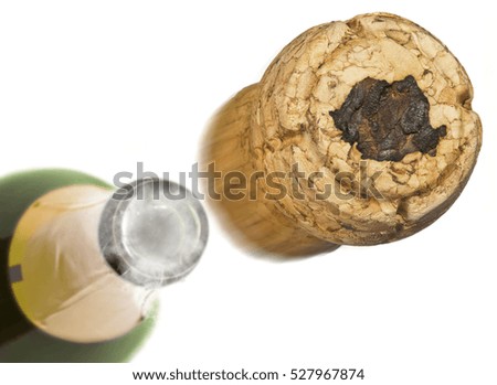 Champagne cork with the shape of Romania burnt in and bottle of champagne in the back.(series)