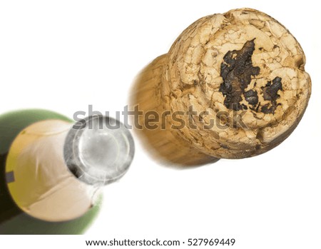 Champagne cork with the shape of Denmark burnt in and bottle of champagne in the back.(series)