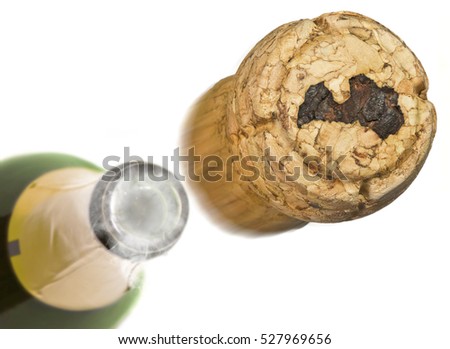 Champagne cork with the shape of Latvia burnt in and bottle of champagne in the back.(series)