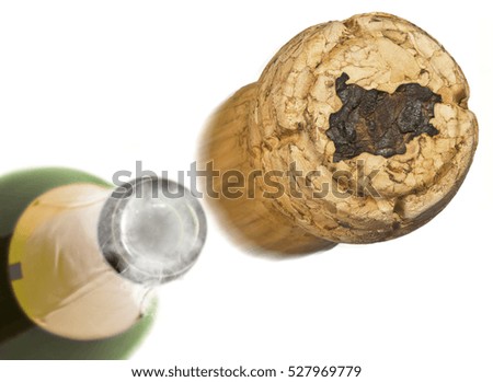 Champagne cork with the shape of Bulgaria burnt in and bottle of champagne in the back.(series)