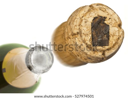 Champagne cork with the shape of Northern Territory burnt in and bottle of champagne in the back.(series)