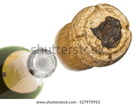 Champagne cork with the shape of Zimbabwe burnt in and bottle of champagne in the back.(series)