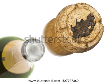 Champagne cork with the shape of South Africa burnt in and bottle of champagne in the back.(series)