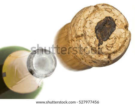 Champagne cork with the shape of Sao Tome and Principe burnt in and bottle of champagne in the back.(series)
